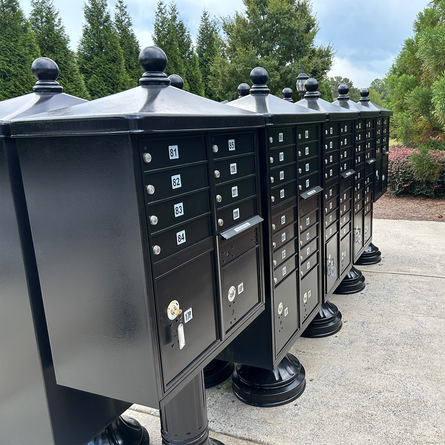 HOME Refinished black community mailbox units for a Metro Atlanta subdivision, freshly painted and restored for HOA curb appeal