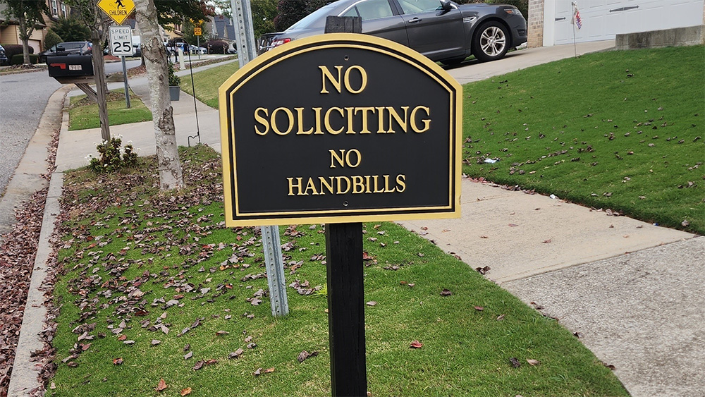 Black and gold Barrington neighborhood no soliciting sign in Metro Atlanta residential community, custom post-mounted HOA signage