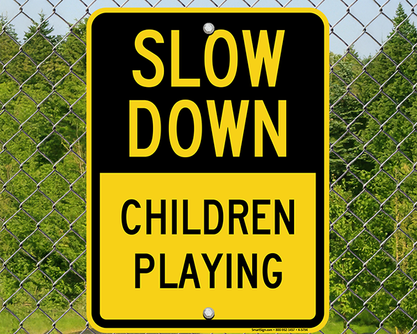 slow down children playing neighborhood speed limit signs