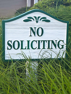 Custom No Soliciting sign installed at a residential neighborhood entrance in Georgia.