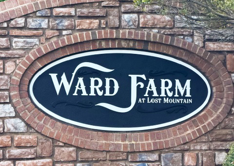 Ward Farm at Lost Mountain stone monument entrance sign with custom routed sign panel.