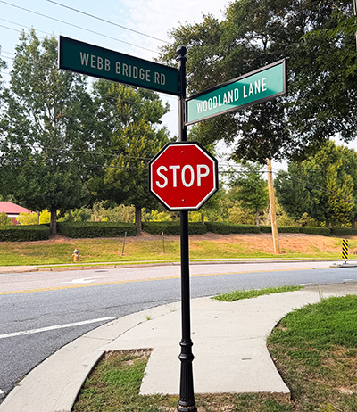 Custom street signs and stop sign for The Woodlands at Webb Bridge community