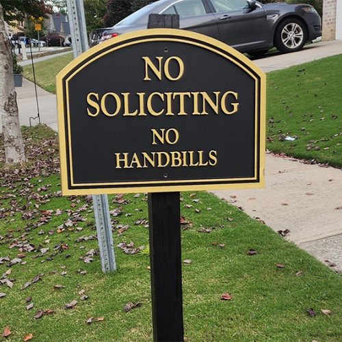 Black and gold Barrington neighborhood no soliciting sign in Metro Atlanta residential community, custom post-mounted HOA signage